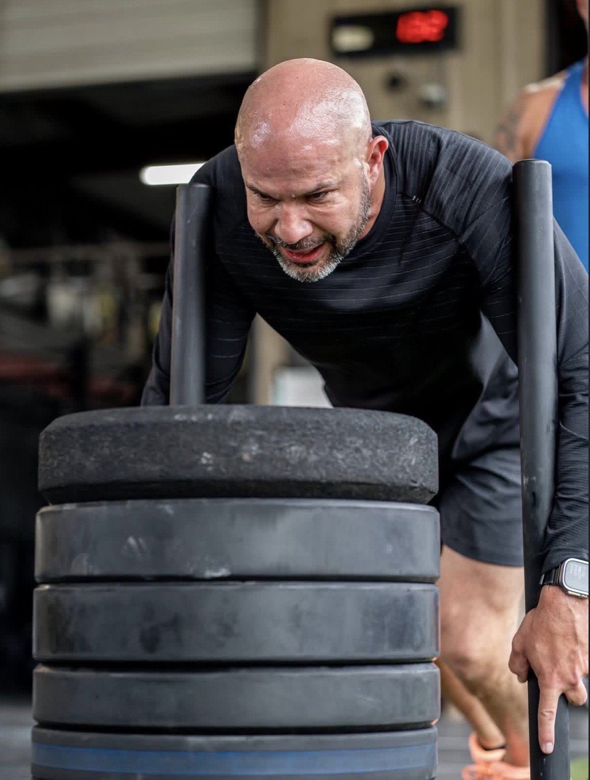 Heavy sled push inside the gym